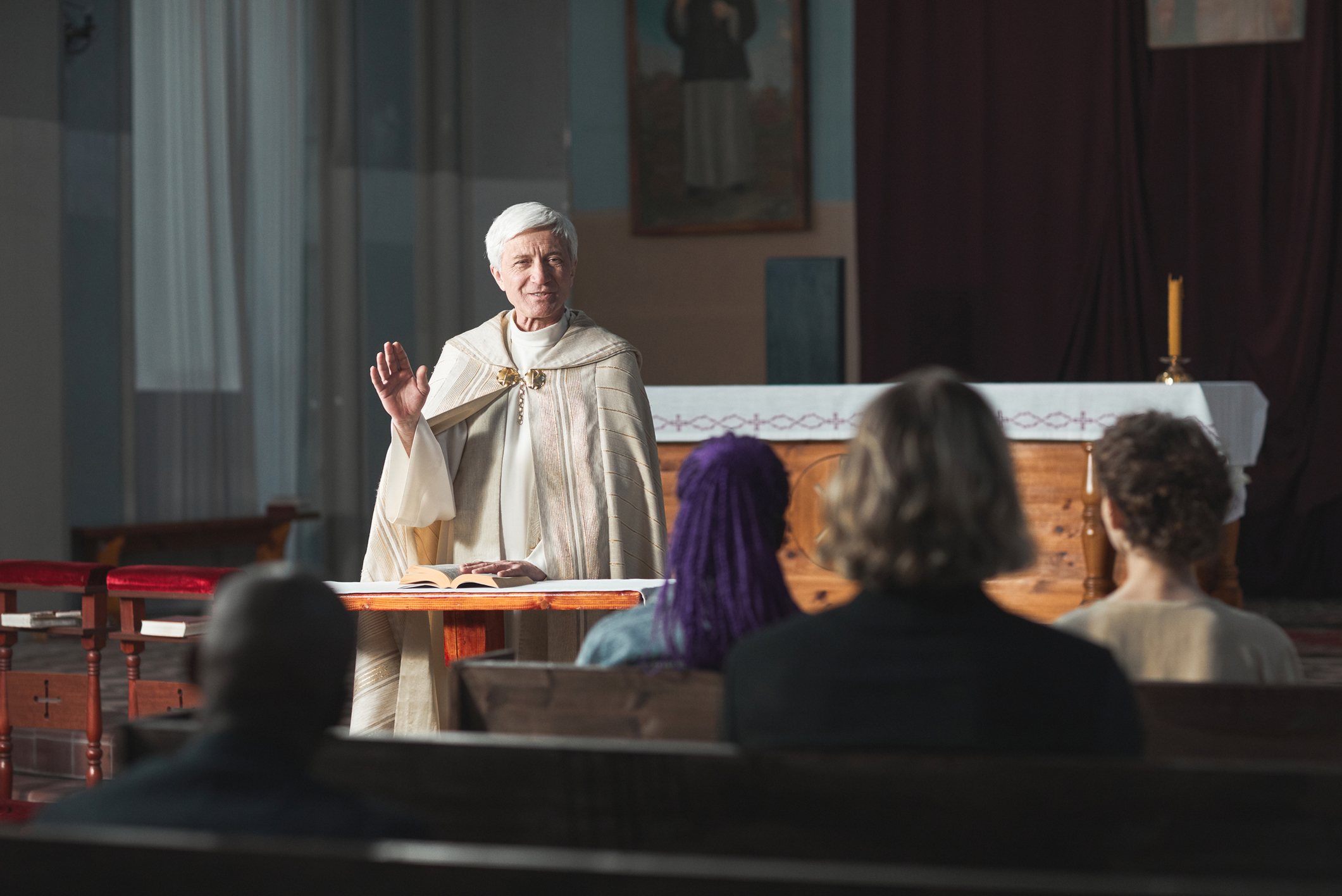 Priest_blessing_the_people_in_the_church